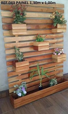 several wooden planters mounted to the side of a wall