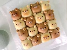 there are many teddy bears made out of cookies on top of each other and placed in the shape of squares