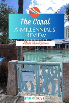 the coral at milleninal's review sign with palm trees in the background