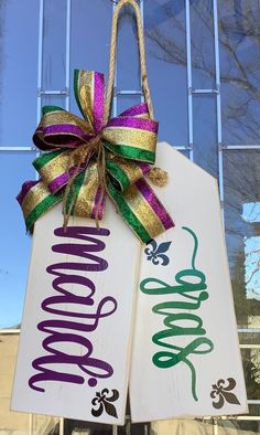 two door hangers decorated with ribbons and bows