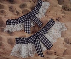 "The garters are perfect for an outdoor or barn wedding! . The garters are made of white lace and black gingham ribbon. The Bridal garter is 3\" tall, it measures14\"relaxed and 22\" stretched. I use a full yard of ribbon, so it still looks gathered even stretched to the fullest. Includes coordinating toss garter that measures almost 2\". One size fits most. All garter sets have heat sealed ribbons to stop fraying. I only use non roll elastic.  I also include 2 strips of fashion double stick tape, just in case you need it on your special day.  Convo me if you need plus sizing or have more questions. Ready to ship, goes out the next business day after purchase. Just choose your color upon purchase." Wedding Garter Toss, Red Garter, Lace Wedding Garter Set, Prom Garters, Bridal Garter Lace, Garter Toss, Wedding Garter Lace, Royal Blue Wedding, Wedding Garter Set