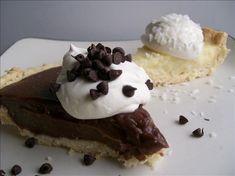 two pieces of chocolate pie with whipped cream on top