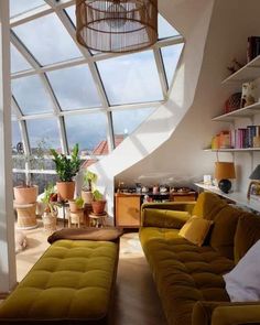 a living room filled with furniture and lots of windows