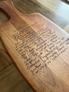 a wooden board with writing on it