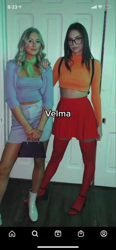 two women standing next to each other in front of a door with the caption velma