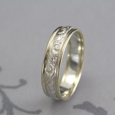 a wedding ring with an intricate design on it