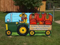 a large sign that says lewis's farm market and petting farm on it