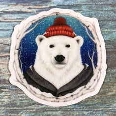 a polar bear with a red hat and coat on it's head is shown