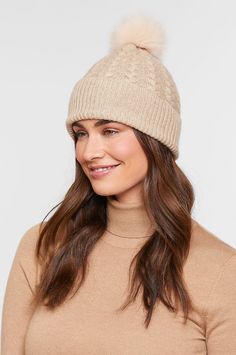 Nothing could be cozier than a cashmere beanie crowned in a genuine fur pom, except for our cashmere beanie crowned with two interchangeable fur poms. And whether you top this knit hat with the luxurious blue fox fur pom or the fluffy raccoon fur pom, you'll be warm, snug, and protected, whether you're running errands or taking your morning walk. Pair this stretchy knit beanie with your jacket, vest, cape, or coat, and let the season be yours. 100% Cashmere. Fluffy Raccoon, Fox And Raccoon, Fur Mom, Cashmere Hat, Cashmere Beanie, Sheepskin Coat, Morning Walk, Jacket Vest, Winter Beanie