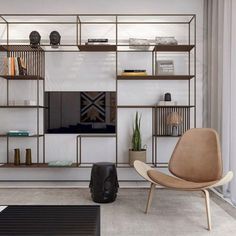 a living room filled with furniture and a flat screen tv on top of a wooden shelf