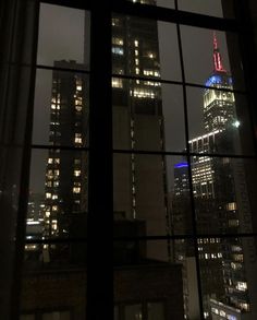 the empire building is lit up at night