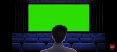 a man standing in front of an empty theater with a green screen on the wall