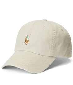 From Polo Ralph Lauren, this cap features:classic baseball cap silhouetteRalph Lauren's signature multicolored Pony embroidered at the frontseamed billsix-panel constructionembroidered ventilating eyeletssweatband at the interior"Polo Ralph Lauren" embroidery and a buckled leather strap at the backApprox. 23 1/4 circumferenceshell is cotton/elastaneback strap is leatherspot cleanImported. Classic Cream Baseball Cap With Curved Visor, Classic Visor Baseball Cap With Embroidered Logo, Classic Trucker Hat With Embroidered Logo Visor, Classic Trucker Hat With Embroidered Logo, Classic Dad Hat With Embroidered Logo And Flat Bill, Casual Flat Bill Baseball Cap With Embroidered Logo, Classic Baseball Cap With Embroidered Logo, Classic Flat Bill Hat With Embroidered Logo, Beige Baseball Cap With Embroidered Logo