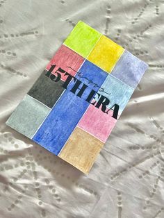 there is a book with the word la tiera on it sitting on a bed