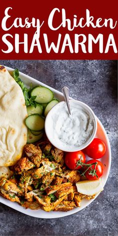 the easy chicken shawama is served on a plate with cucumbers and tomatoes