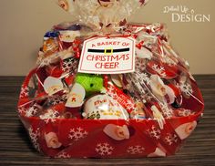 a red basket filled with lots of christmas treats