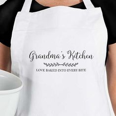 a woman wearing an apron with the words grandma's kitchen printed on it next to a bowl