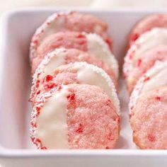 red velvet donuts with white frosting in a pink dish