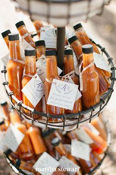 a basket filled with lots of different types of condiments on top of a table