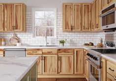 a kitchen with wooden cabinets and white marble counter tops, along with stainless steel appliances