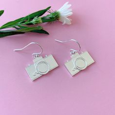 Camera earrings, sterling silver camera earrings, camera jewelry, photography, gift for photographer, Instagram photographer  These handmade camera earrings are made in sterling silver. They are minimal and simple yet you can see all the details.They make perfect gift for a photographer friend or an artist person! They are a must have! They are light and comfortable for casual use or special events. Dimensions:  Camera: 1.9 cm x 1.1 cm Drop length: :1.2 cm Camera Earrings, Camera Jewelry, Gift For Photographer, Bird Watcher Gifts, Photographer Instagram, Tiny Bird, Gifts For Photographers, Bird Earrings, Tiny Stud Earrings