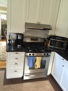 the kitchen is clean and ready for us to use it's new stainless steel appliances