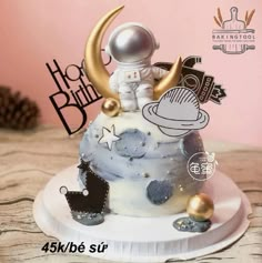 a cake with an astronaut on top of it