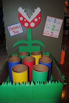 a cardboard box filled with lots of different colored cups