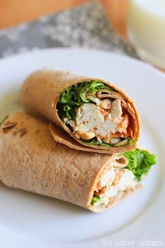 two wraps are sitting on a white plate