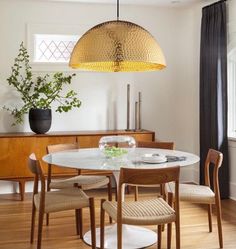 a dining room with a table and chairs