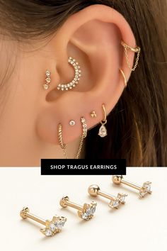 three pairs of ear piercings with crystal stones