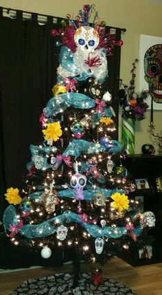 a decorated christmas tree with skulls and flowers