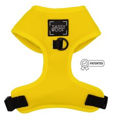 the sassy woof harness is yellow and has black buckles on each side