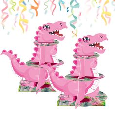 two pink dinosaurs are standing in front of streamers