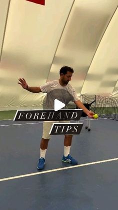 a man standing on top of a tennis court holding a racquet and ball