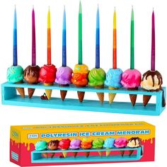 an assortment of ice cream cones and candles