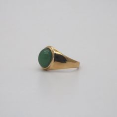 The dainty ring features a piece of green jade which in oval shape, vintage and classic looking. 18k gold plated Stainless steel Waterproof, tarnish free Available in US size 6-11 Ring sizing chart Heirloom Green Emerald Oval Cabochon Ring, Heirloom Green Oval Cabochon Emerald Ring, Heirloom Gold Emerald Ring With Oval Cabochon, Heirloom Style Green Emerald Ring With Polished Finish, Classic Green Open Signet Ring, Heirloom Style Polished Emerald Ring, Timeless Green Signet Ring With Polished Finish, Green Oval Cabochon Signet Ring, Green Oval Cabochon Gemstone Signet Ring