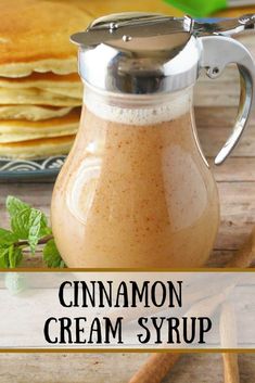 cinnamon cream syrup in a glass pitcher next to pancakes