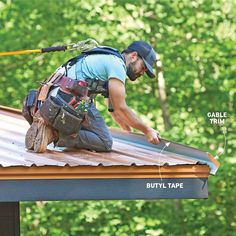 a man working on the roof of a house with tools attached to his back and hands