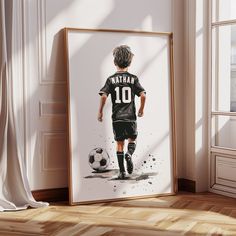 a painting of a young boy playing soccer in black and white with the number 10 on it