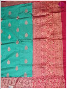 Adorn yourself in this Banarasi Katan silk saree in turquoise Blue with rigorously crafted zari woven floral motifs sprinkled over the fabric. The alluring blue body teams up with the pinkish red border and pallu. The zari woven floral pattern in pinkish red hue beautifully blends with the fabric, which results in grabbing attention with every move. The harmonious combination of blue and red is visually appealing, making this saree a perfect choice for those, who seeks elegance and vivacity for Turquoise Semi-stitched Bollywood Saree, Turquoise Bollywood Saree With Dupatta, Bollywood Style Turquoise Saree With Dupatta, Turquoise Bollywood Traditional Wear For Festive Occasions, Bollywood Style Turquoise Traditional Wear For Festive Occasions, Unstitched Turquoise Saree, Festive Turquoise Saree In Traditional Drape, Festive Turquoise Saree With Traditional Drape, Turquoise Chanderi Traditional Wear For Festivals