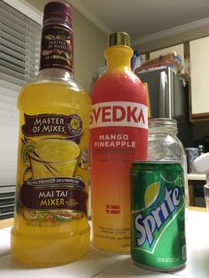 three different types of drinks sitting on a counter