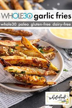 an advertisement for whole 30 garlic fries on a plate with dipping sauce in the background