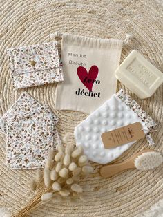 some items are laying on top of a woven mat with the words love to dechet