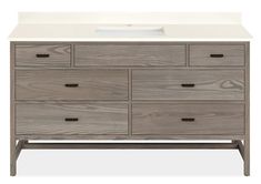 an image of a bathroom vanity with drawers and a white counter top in grey wood