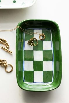 Lifestyle image of the Green Checkered Ceramic Trinket Dish Checkered Jewelry Dish, Square Trinket Dish, Golf Clay Ideas, Pottery Dish Ideas, Ceramic Coaster Painting Ideas, Hand Painted Trinket Dish, Trinket Tray Painting Ideas, Trinket Dish Painting Ideas, Handmade Ceramics Ideas Pottery