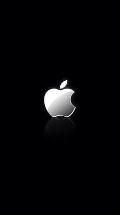 an apple logo is shown in the dark