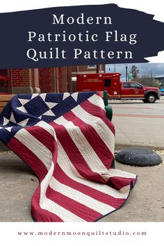 an american flag quilt on the ground with text overlay that reads modern patriotic flag quilt pattern