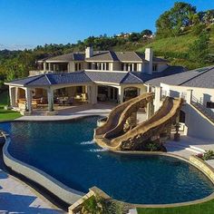 this is an aerial view of a house with a pool and slide in the yard