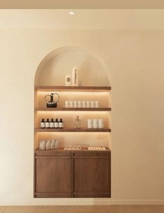 an empty room with shelves filled with items